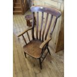A mid 19th Century beech and elm country armchair
