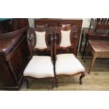 A pair of Edwardian mahogany dining chairs