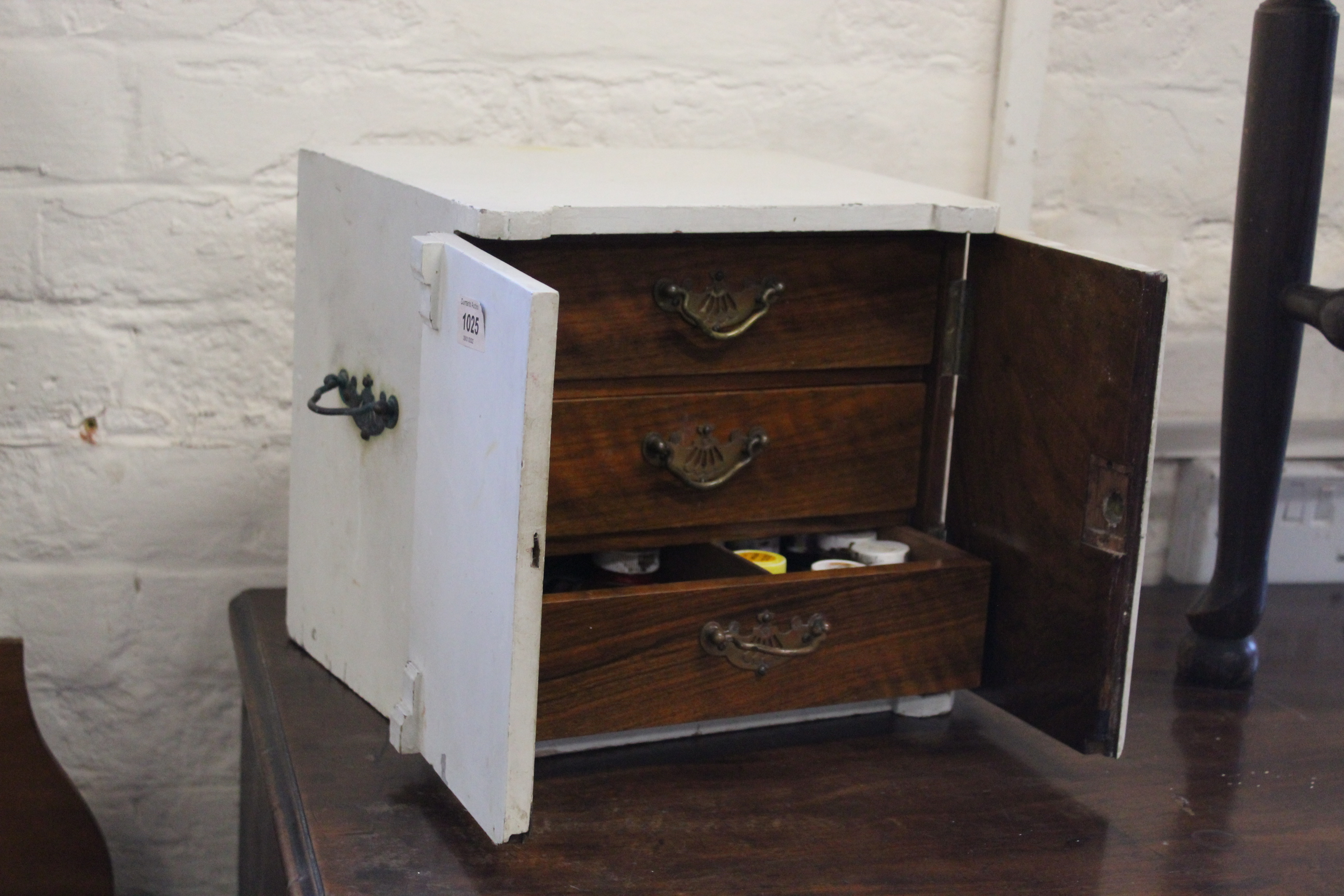 An Edwardian painted mahogany table chest with contents