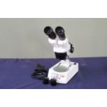 A modern Celestron Labs binocular microscope,