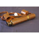 A mid 20th Century patinated brass and leather bound three drawer telescope,