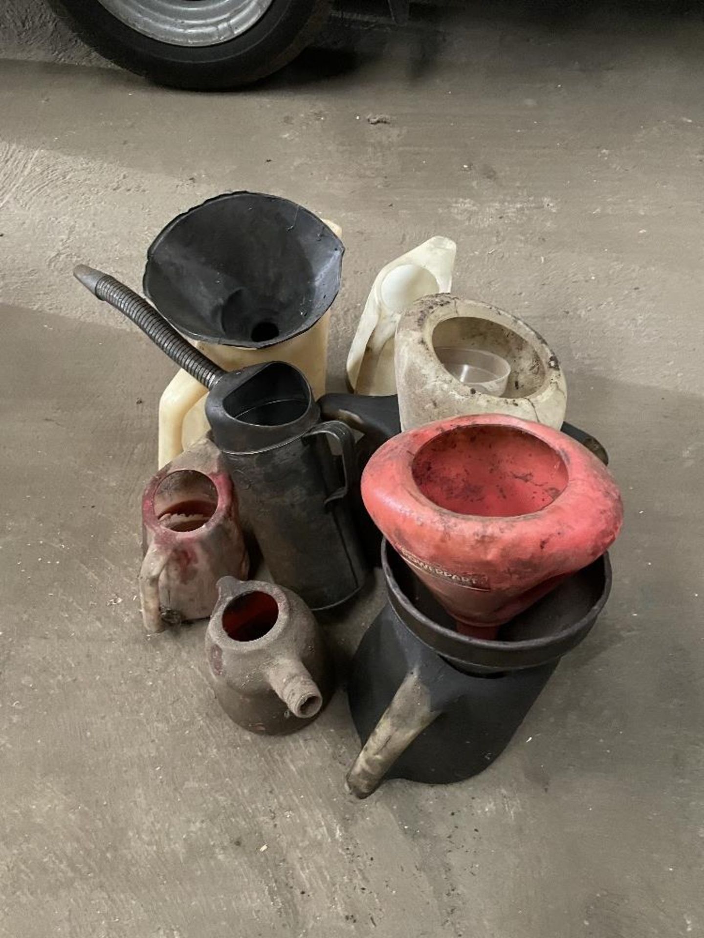 Quantity of Oil Jugs and Funnels