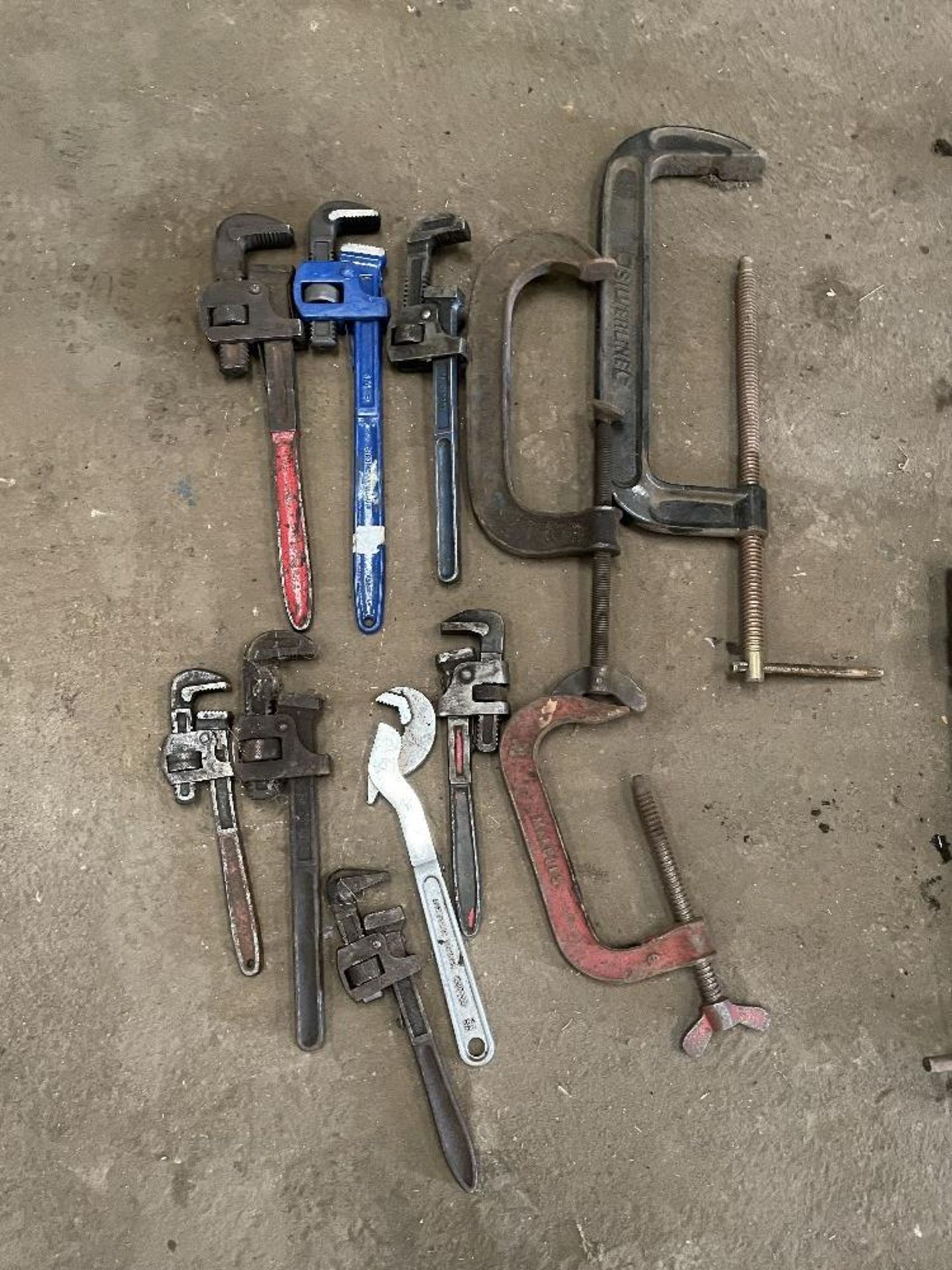 Quantity of Adjustable Stilson/Pipe Wrenches and 3 x G Clamps