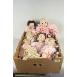 A box of vintage bisque head collectors dolls