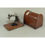A vintage 'Lead' mini sewing machine in box
