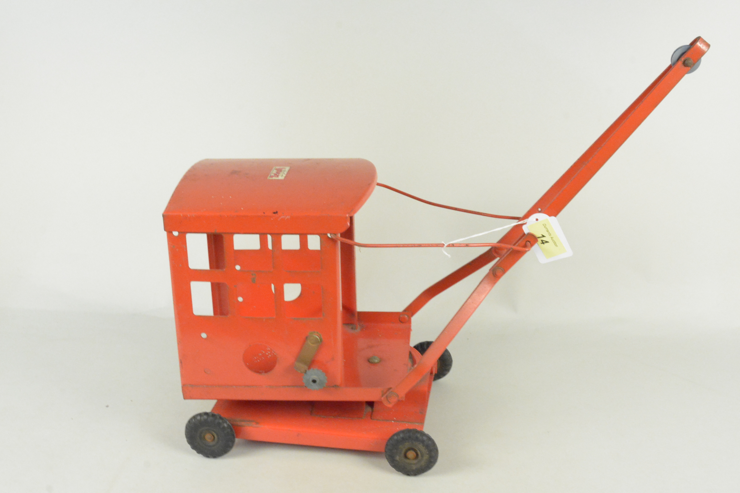 A vintage Triang red finish crane,