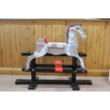 A vintage hand painted rocking horse,