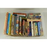 A box of mixed vintage childrens annuals and story books including Enid Blyton etc