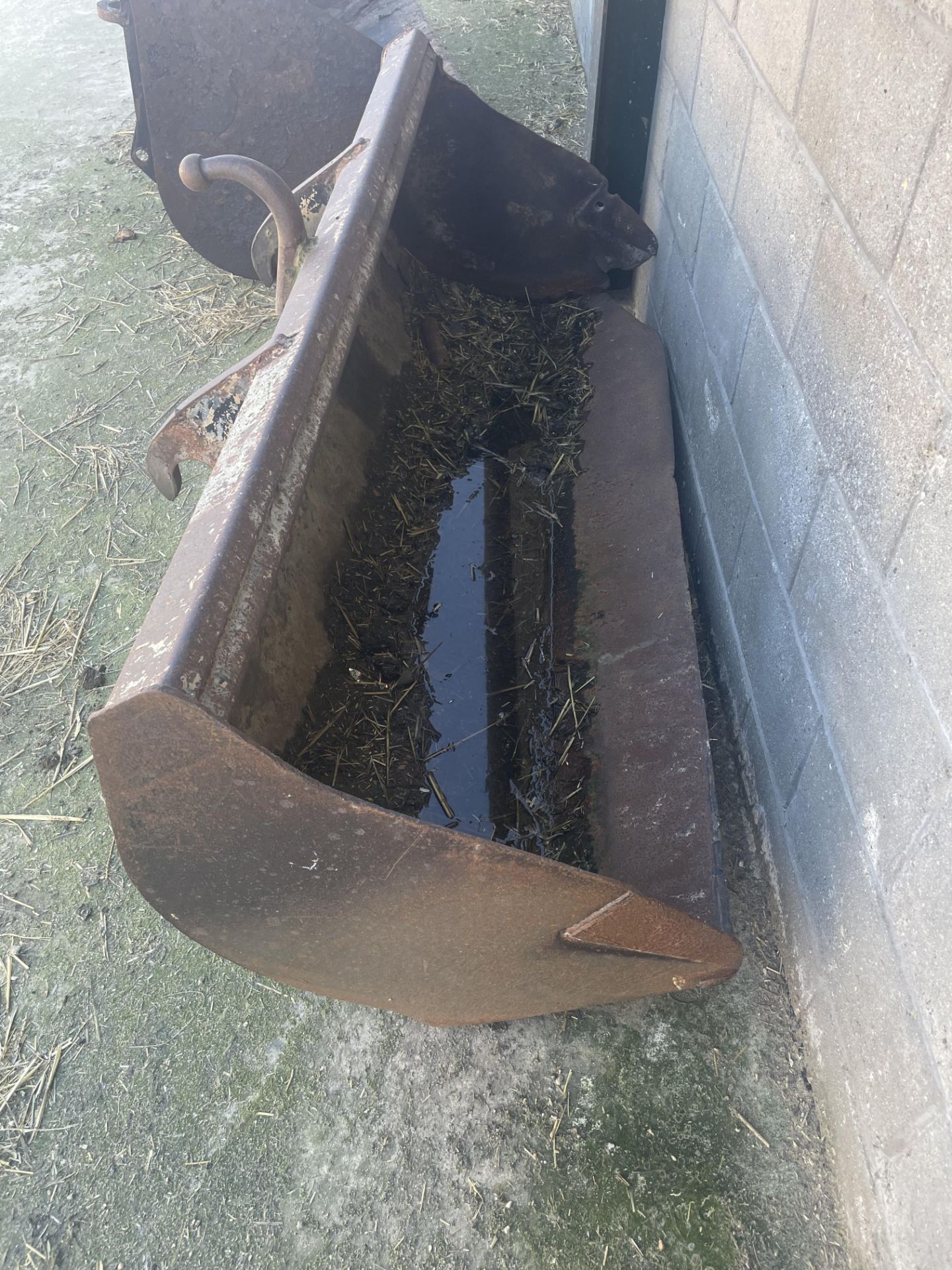 JCB Bucket for JCB 2CX, worn to front. Stored near Beccles, Suffolk.