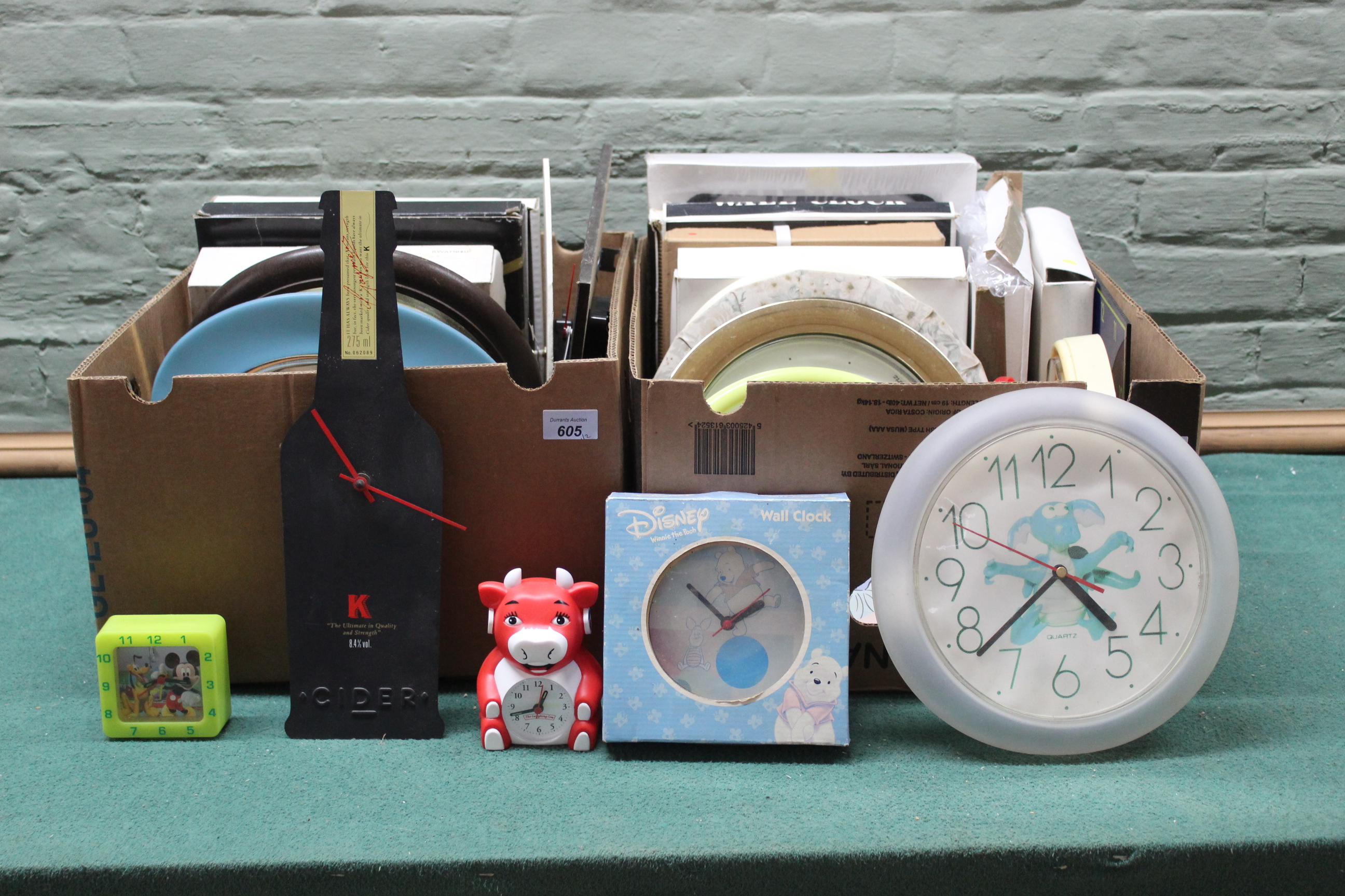 Two boxes of approx twenty four wall clocks,