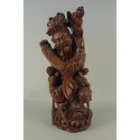 A Chinese carved hardwood figural group,