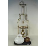 An Edwardian brass handing oil lamp, now converted to electricity,