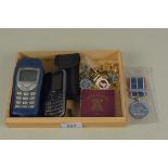 A National Service medal, 1951 commemorative coins, a selection of badges,