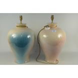 A large pair of mottled pink and green baluster shaped lamp bases,