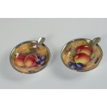 A pair of silver mounted Royal Worcester ashtrays decorated by E Townsend