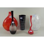 A red glass twist stem Studio vase, a black cylindrical glass vase with trailing opaque lines,