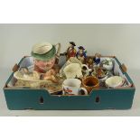 A box of mixed ceramics including a Toby jug, mottoware, tankards,