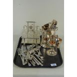 A late 19th Century cut glass silver plated eight bottle cruet stand on paw feet,