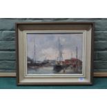 A framed oil on board of sailing ships at a quayside with strolling figures, signed 'W Davies',