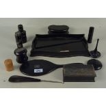 An ebony part dressing table set on tray,