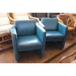 A pair of vintage blue leather tub chairs