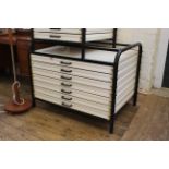 A large set of steel and plastic utilitarian drawers