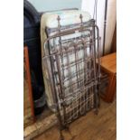 A late Victorian child's steel cot with vintage mattress