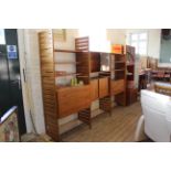 An impressive set of teak Ladderax furniture by Staples featuring a chest of drawers,