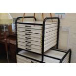 A set of steel and plastic utilitarian drawers,