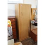 A bleached teak veneered single wardrobe