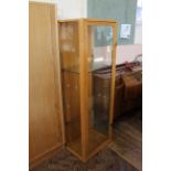 A teak display cabinet with two glass shelves