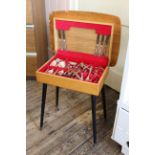 A c.1960's teak canteen of cutlery on ebonised and brass capped legs