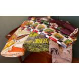 A quantity of vintage fabrics including a bolt of deck chair material