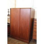 An Austinsuite of London teak double wardrobe,