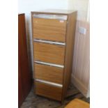 A vintage teak veneer filing cabinet