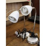 A pair of retro style chrome table lamps with ceramic shades