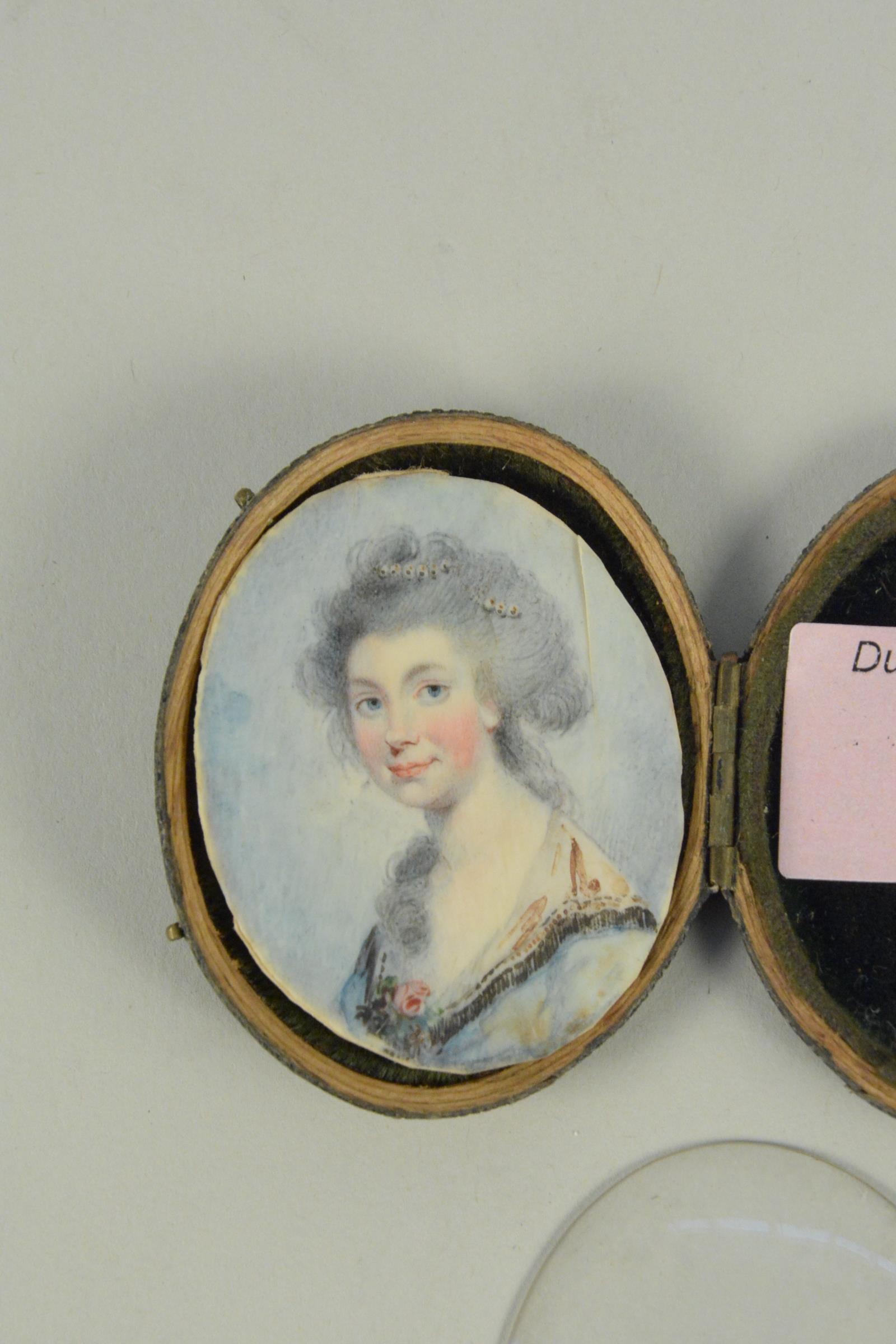 An early 19th Century cased oval miniature on ivory of a lady - Image 2 of 3