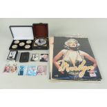 A selection of mixed Marilyn Monroe collectables including cased gilded coins, fridge magnets,
