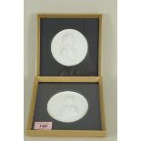 A pair of framed plaster profile busts of Nelson and Wellington
