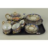 A Japanese porcelain hand painted tea set of twenty one pieces