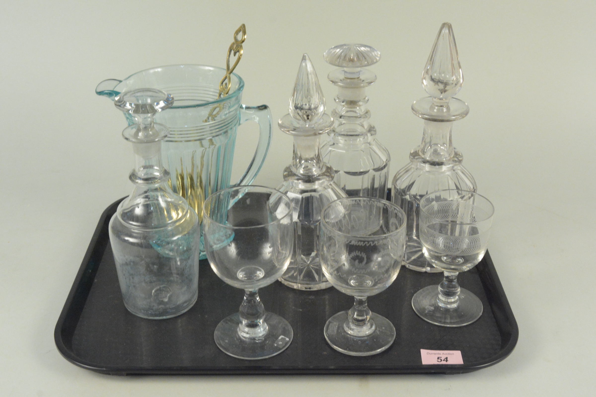A mixed lot of glass comprising of four various 19th Century decanters, three wine glasses,