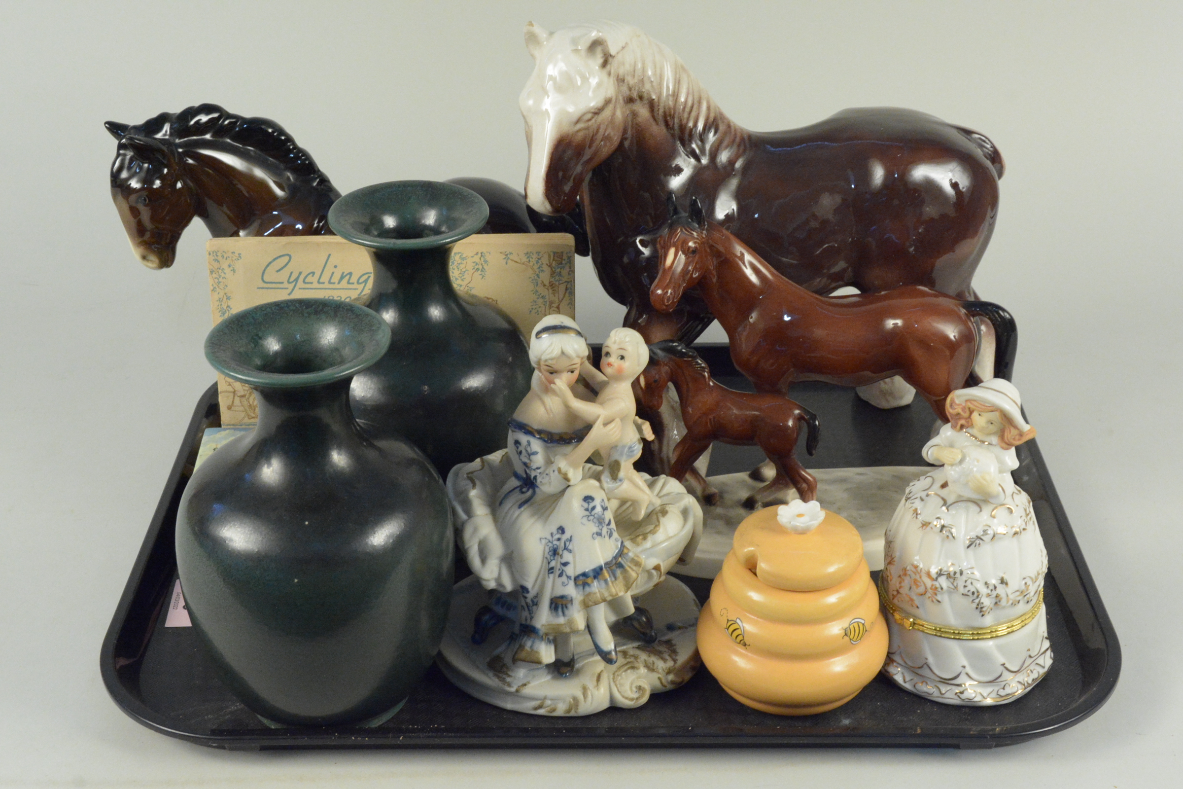 Two ceramic dray horses plus a mare and foal,