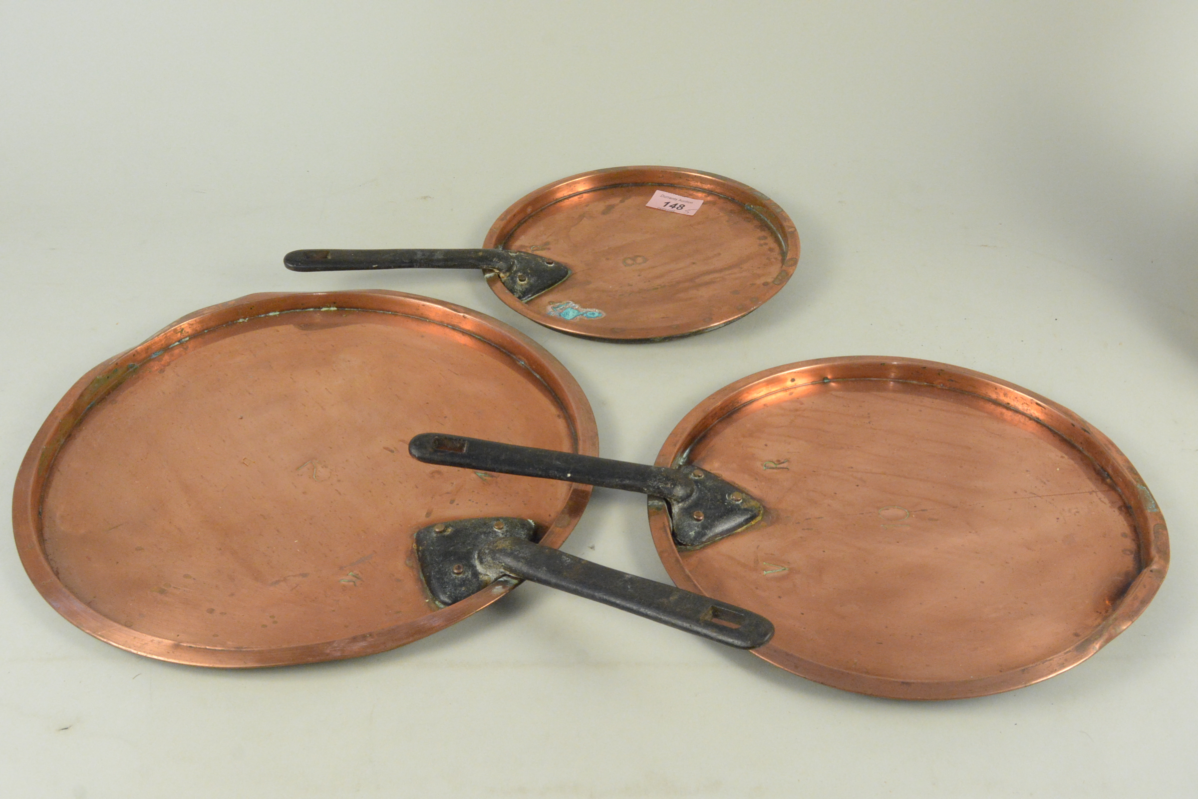 A set of three graduated copper saucepan lids stamped VR, a 1 gallon brass harvest measure, - Image 2 of 3