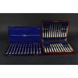 A set of twelve fruit/dessert knives and forks,