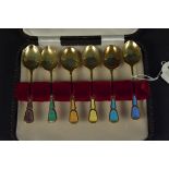 A set of six silver gilt enamelled teaspoons,