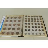 A folder of mixed 20th Century UK circulated coinage including a 1/2 penny, 3D, 6D, shillings,