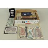 A quantity of UK currency and commemoratives including slabbed and loose banknotes,
