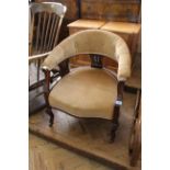 A mahogany framed upholstered tub chair on cabriole legs,
