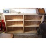 Stripped pine open bookshelves