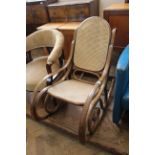 A Thonet style bentwood rocking chair with cane work seat and back